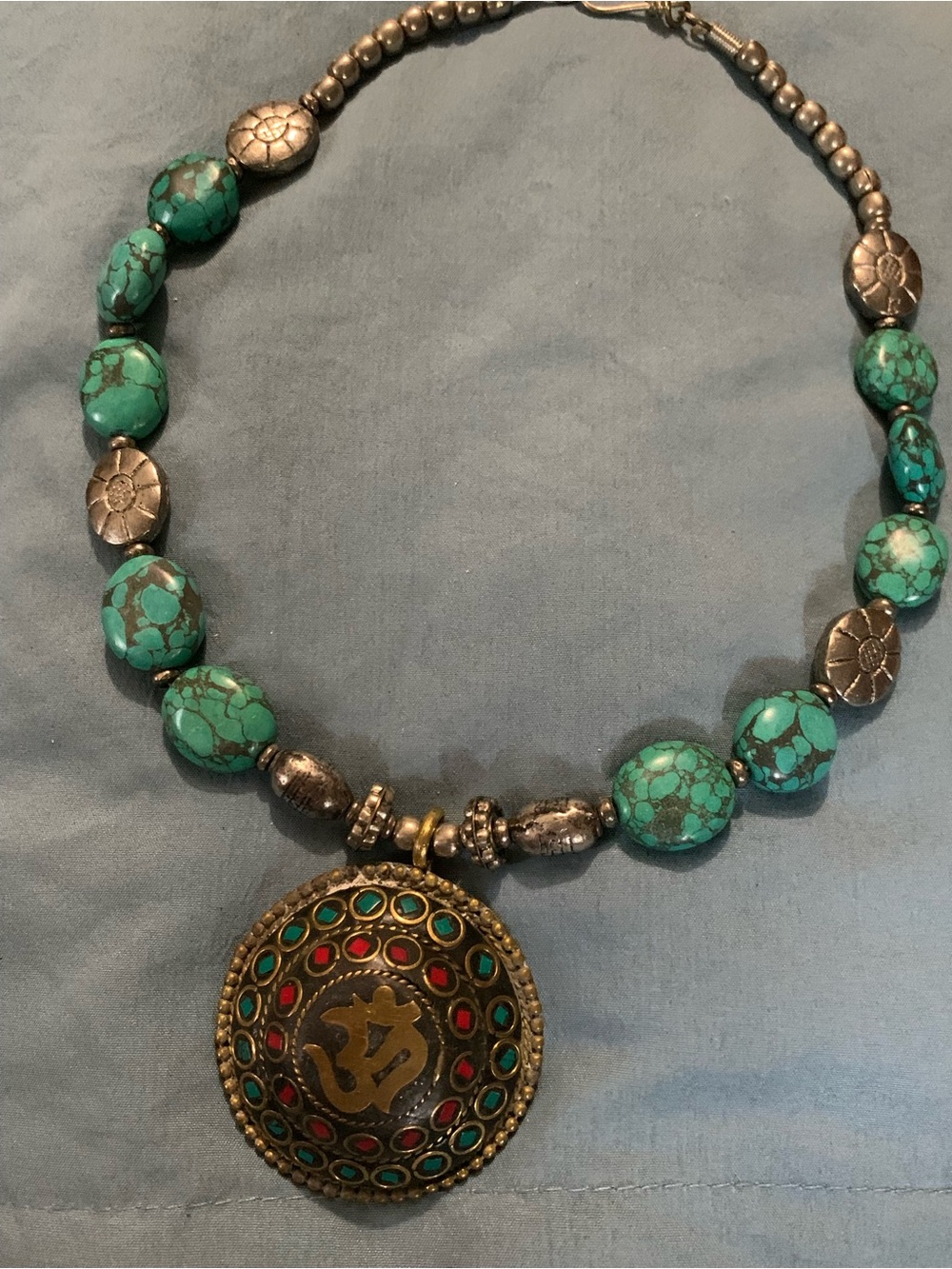 Nepal Turquoise Bead Necklace with Decorative Om Pendant and Silver Accent Beads